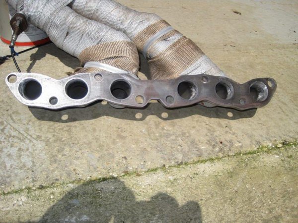 Exhaust manifold flange gasket matched.

That will let a few more horses out :)

(This made an amazing difference)

When new, this manifold had a twisted face and required planing by 4mm and als