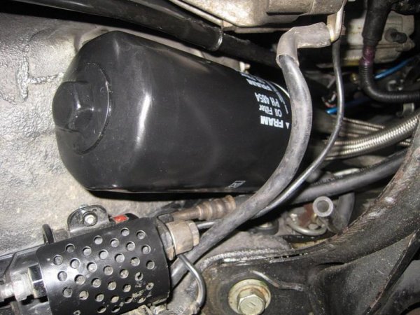 A Supra oil filter relocation block converted to accept a Fram PH4854, using a bespoke M20-1.5 to 3/4"-16 bush. 

This upgrade fits snugly just above the fuel filter, and is nice and easy to ge