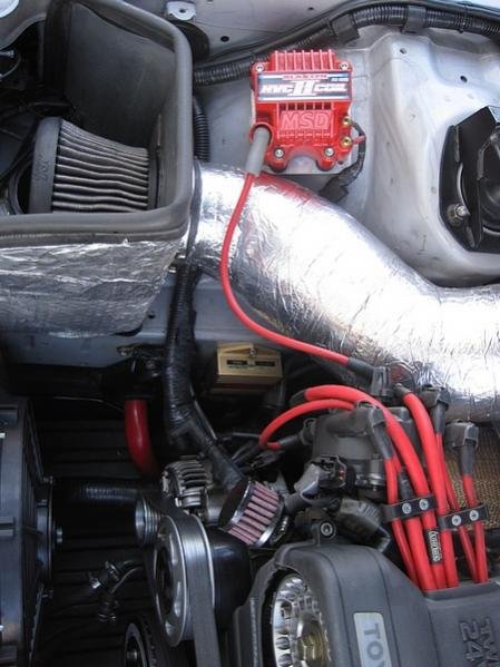 HKS Twin Power Ignition Amplifier, MSD Blaster II coil, Nology Hot Wires and 4Runner distributor cap.

Below can be seen the Meziere electric water pump, 200 amp alternator, ATI crank pulley and TRD