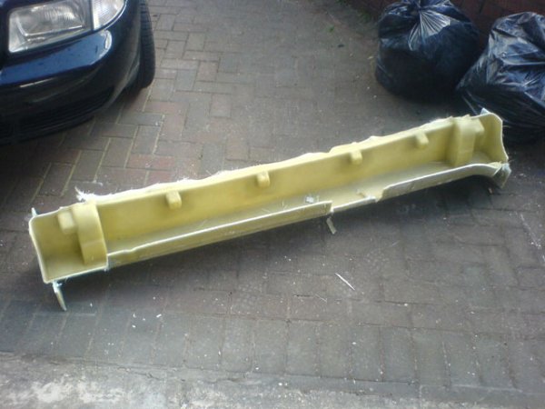 Alfa 75 sideskirt laid up in mold made of GRP.