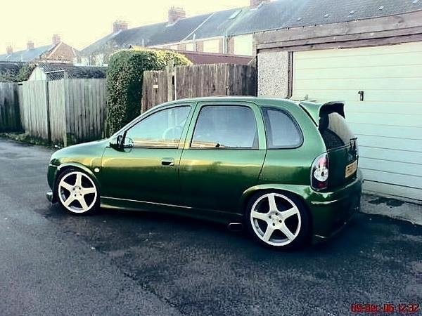 after its final trip to the bodyshop, rear doors smoothed, de locked, tinted windows, full combat bodykit, spoiler, de badged, fresh paint metal flaked (looked awesome at night), lowered 60 mm on coilovers, 17" rims, twin side exit zorsts!