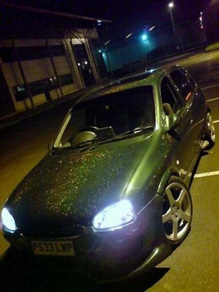 after re spray in metalflake, hard to tell from this pic but it was holographic rainbow flake, gave an ilusion if sparkle to the eye that stood about an inch off the car, was cool in the right light :P

total cost for re spray £350