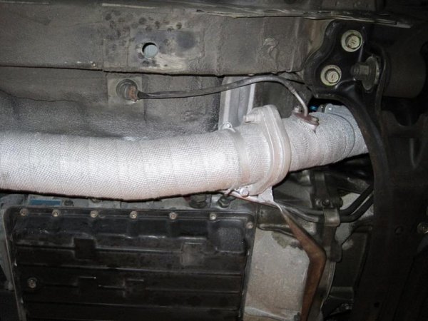 This is the OE cat overheat sensor, that has now been replaced with an AEM EGT sensor.
3" Blitz mid pipe, thermal wrapped.