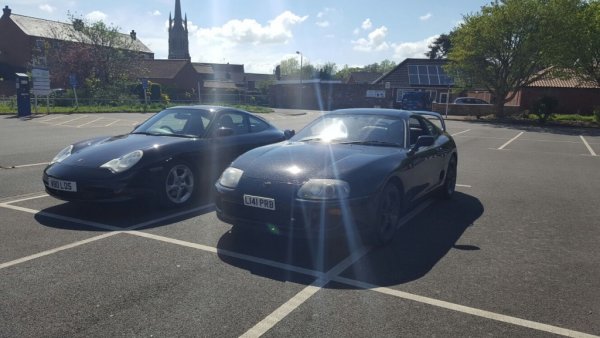 Our cars on a rare sunny day, left the Beemer at home